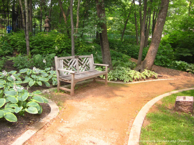 Bench in shaded area of Leo Mol Sculpture Garden