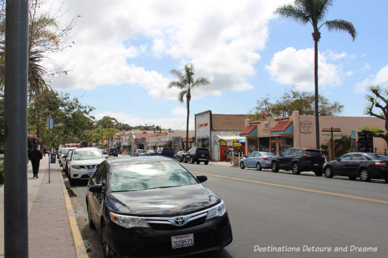 Street lined with historical buildings and palm trees in Old Town San Diego neighbourhood