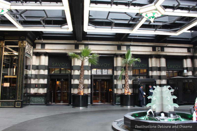 Covered outside art deco entrance area of the Savoy Hotel in London