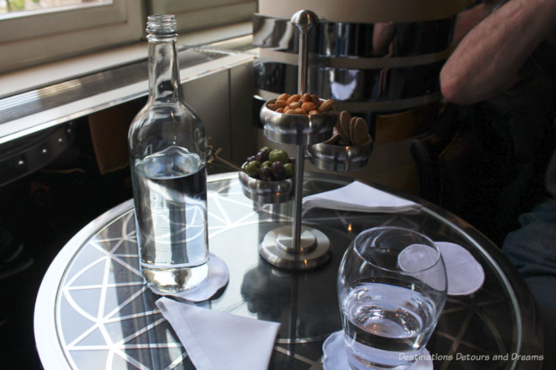 Three-tiered dish of olives, rice crackers, and cashews at the Savoy Hotel American Bar