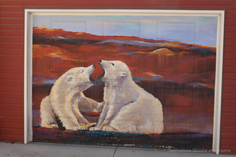 Winnipeg Arctic Gallery Polar Bears Painting of two polar bears against a red landscape on a garage in Arctic Alley, Winnipeg