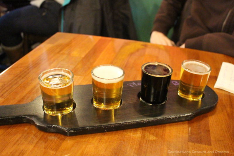 A flight of four craft beer samples