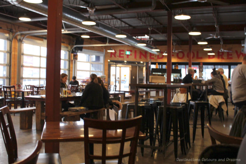 Tables in the industrial-looking space that is the Refined Fool taproom and Burger Rebellion restaurant in Sarnia
