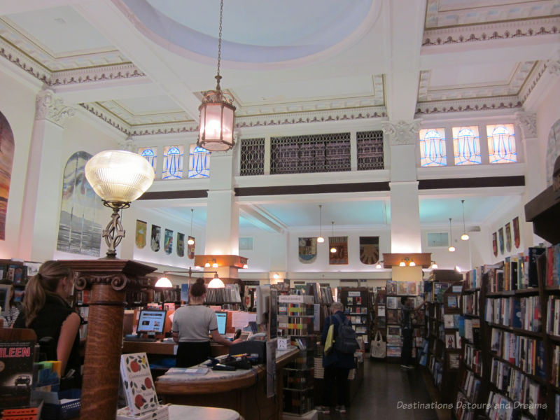 Book store interior with high ceilings and white pillars