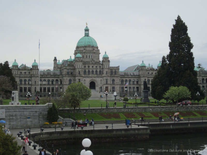 British Columbia Parliament Buildings, Neo-Baroque stone buildings with a central dome and two end pavilions
