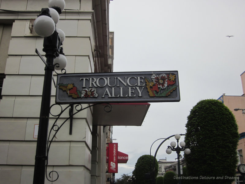 Metal street sign saying Trounce Alley