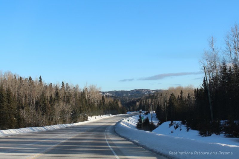 Canadian highway in winter with snow alongside the road