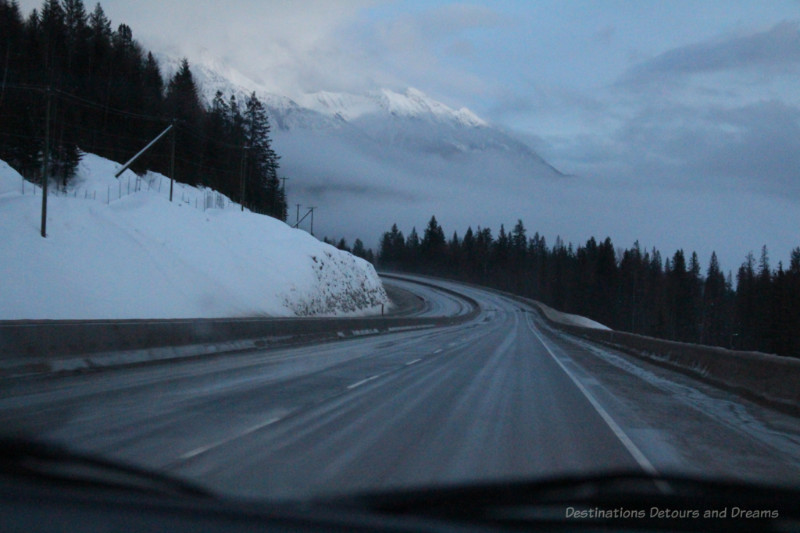 Curving mountain highway as night begins to fall