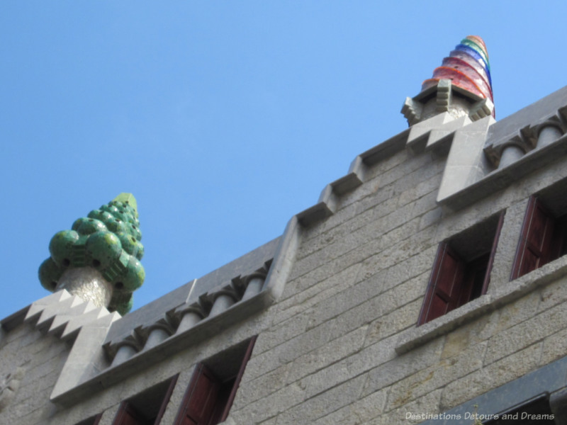 Cones of multi-coloured ceramic pieces covering the chimneys of Palau Güell