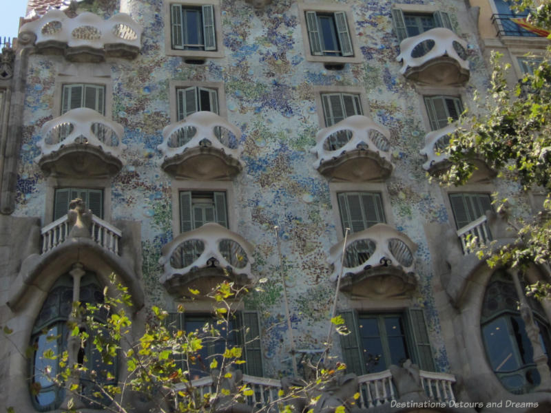 The multi-coloured facade and skeleton-like balcony railing of Gaudí's Casa Batlló