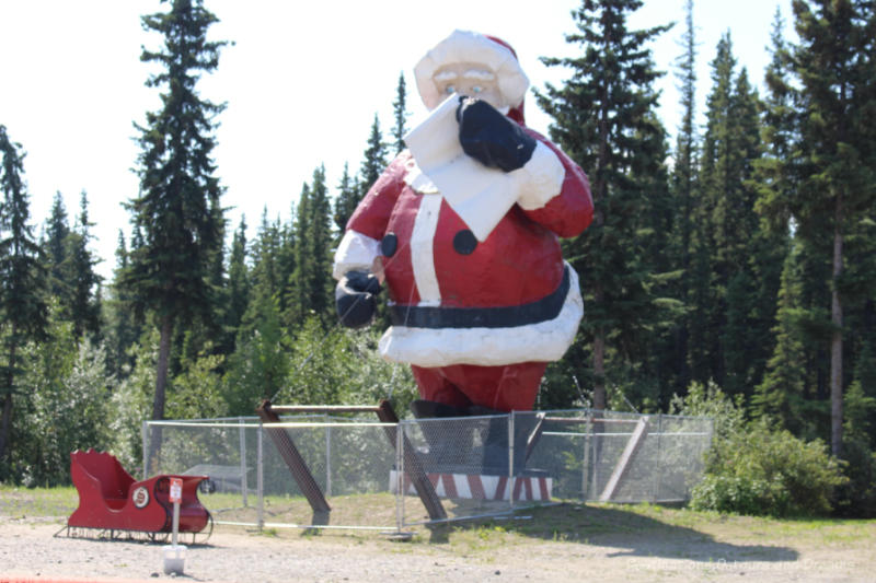 Giant Santa with a list statue