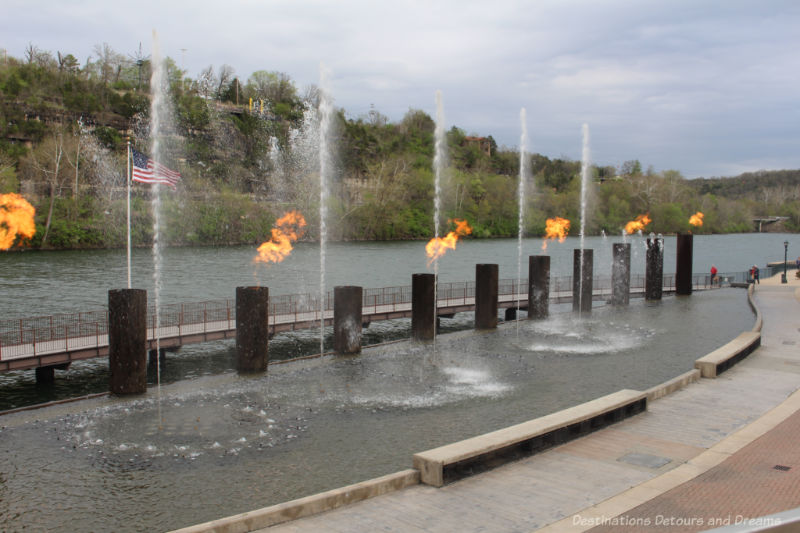 Branson Landing Fountains shooting fire amid a fire display along Lake Taneycomo
