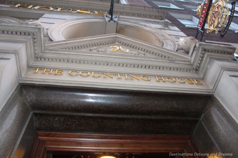 Sign above door at entrance to The Counting House Pub in London