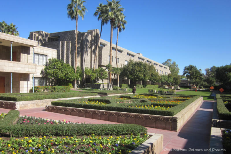 Raised flower beds encased in stone amid landscaped grounds of Arizona Biltmore