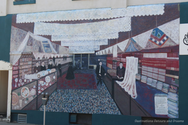 A mural that is a pixelated painting of the inside of a store in 1902